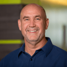 Smiling man in dark blue shirt